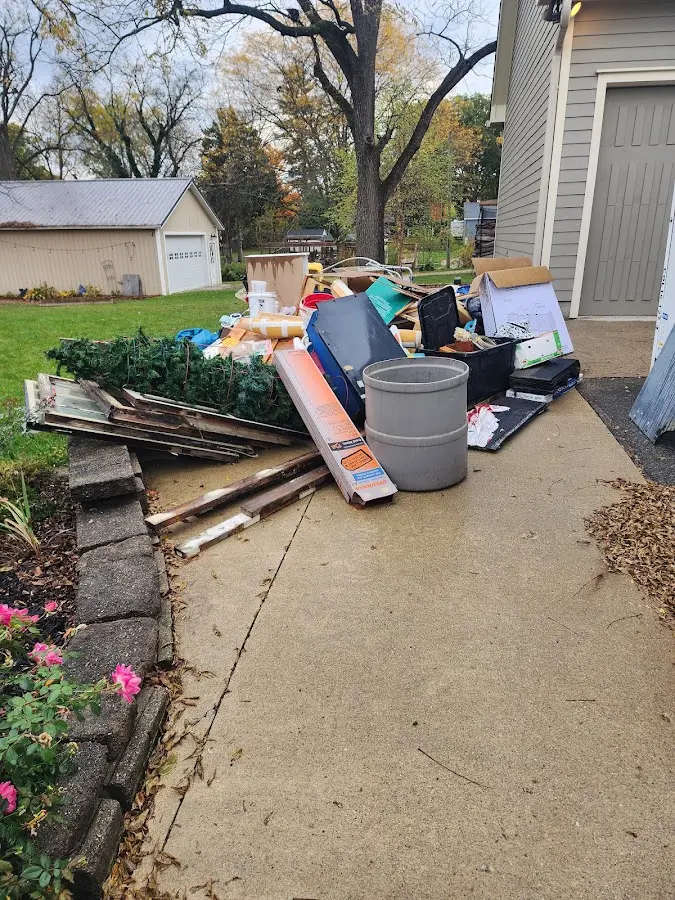 Dumpster being loaded with debris for 30 Yard Dumpster Rental in Woodburn
